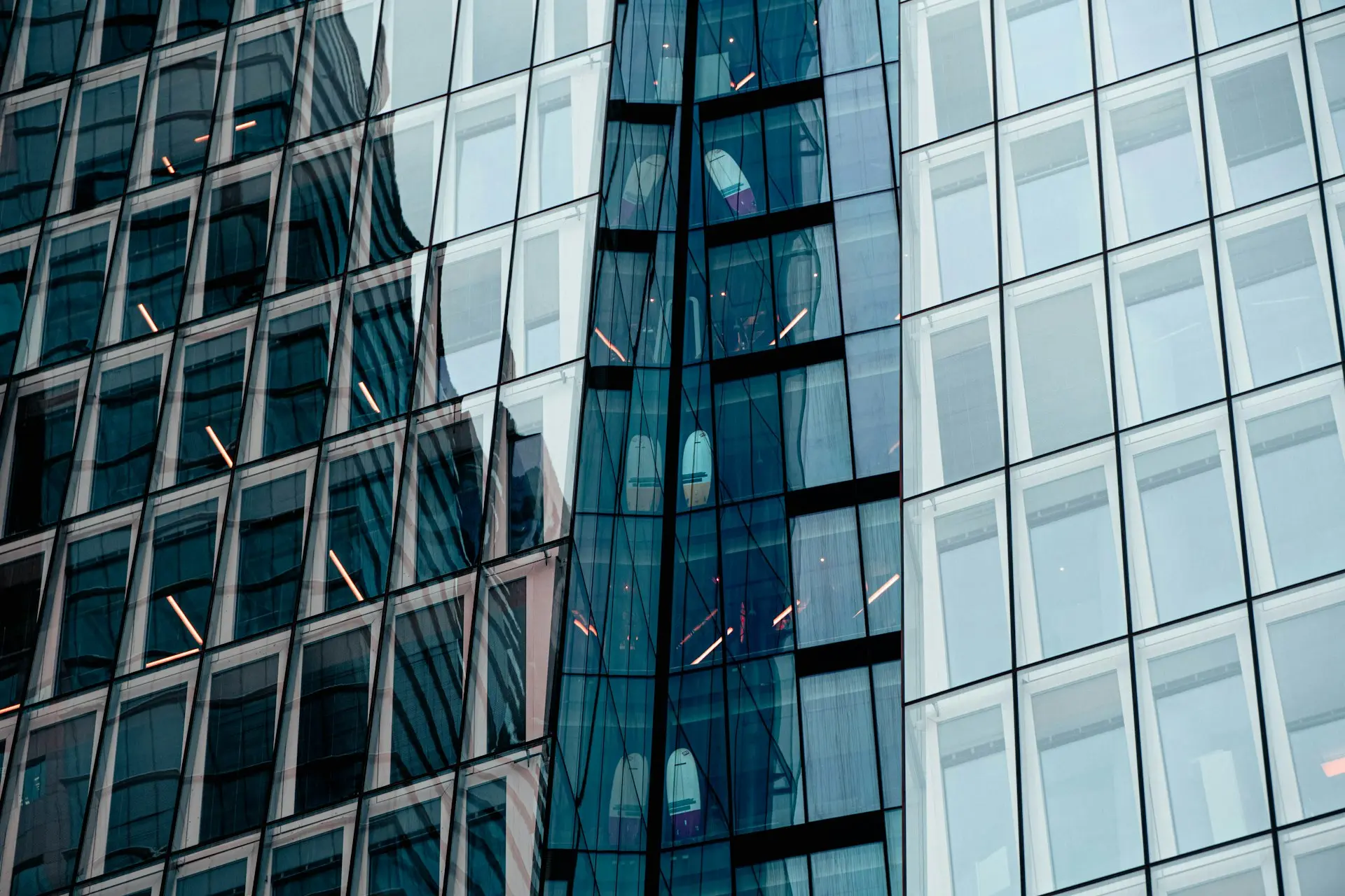 blue and brown glass walled high rise building